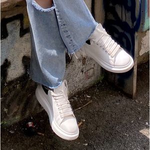 Alexander McQueen white sneakers, black suede